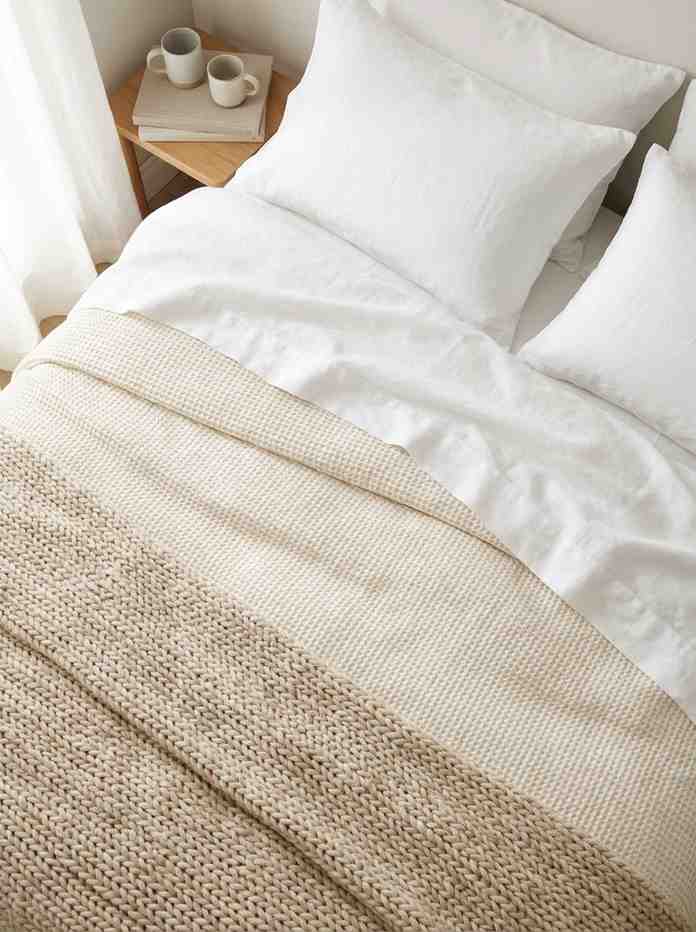 Minimalist bed with white linen 202607062310