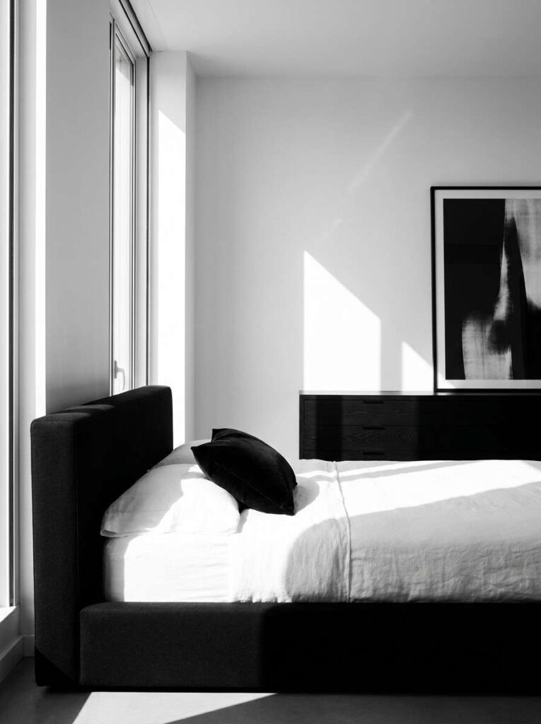 Minimalist bedroom with black bed 202607062310
